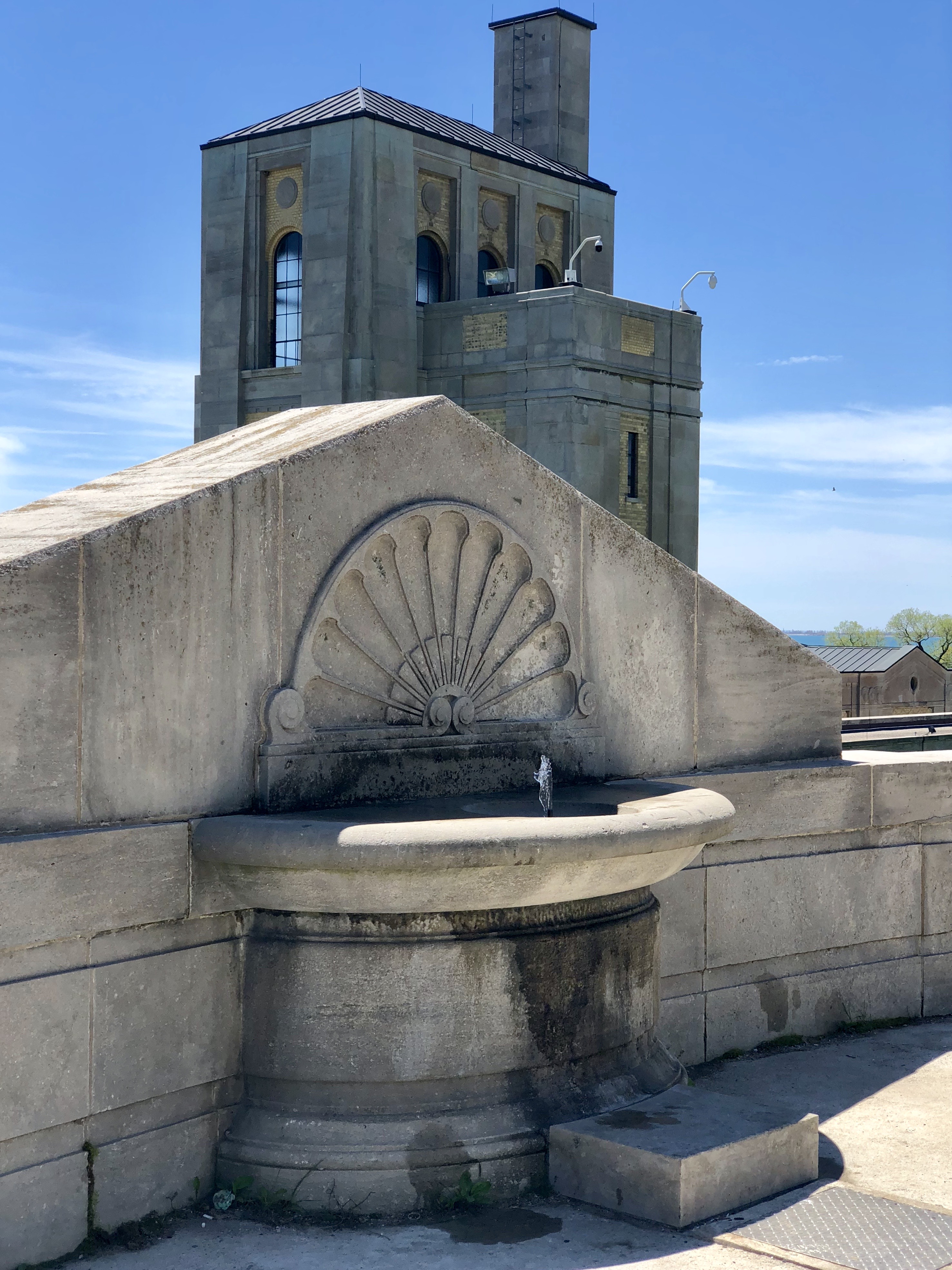 Front fountain of the H.C. Harris water treatment plant of Toronto, under a blue sky